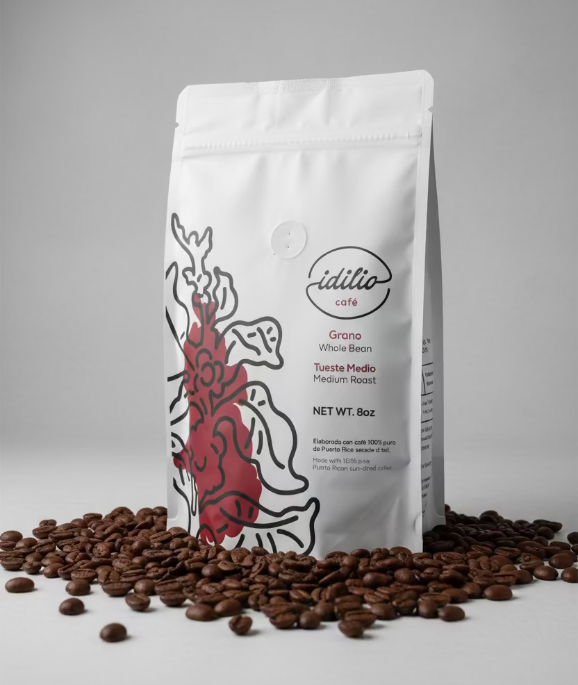 Coffee bag with 'idilio cafe' branding on a red background